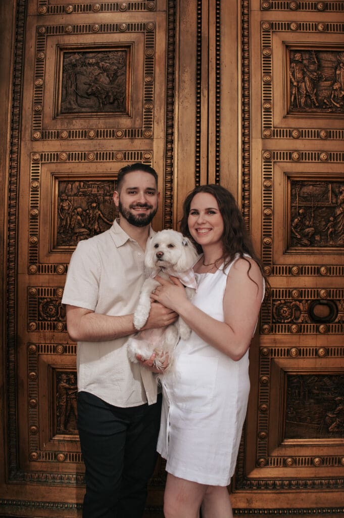Joyful Downtown Portland engagement photo with a couple and their small dog.