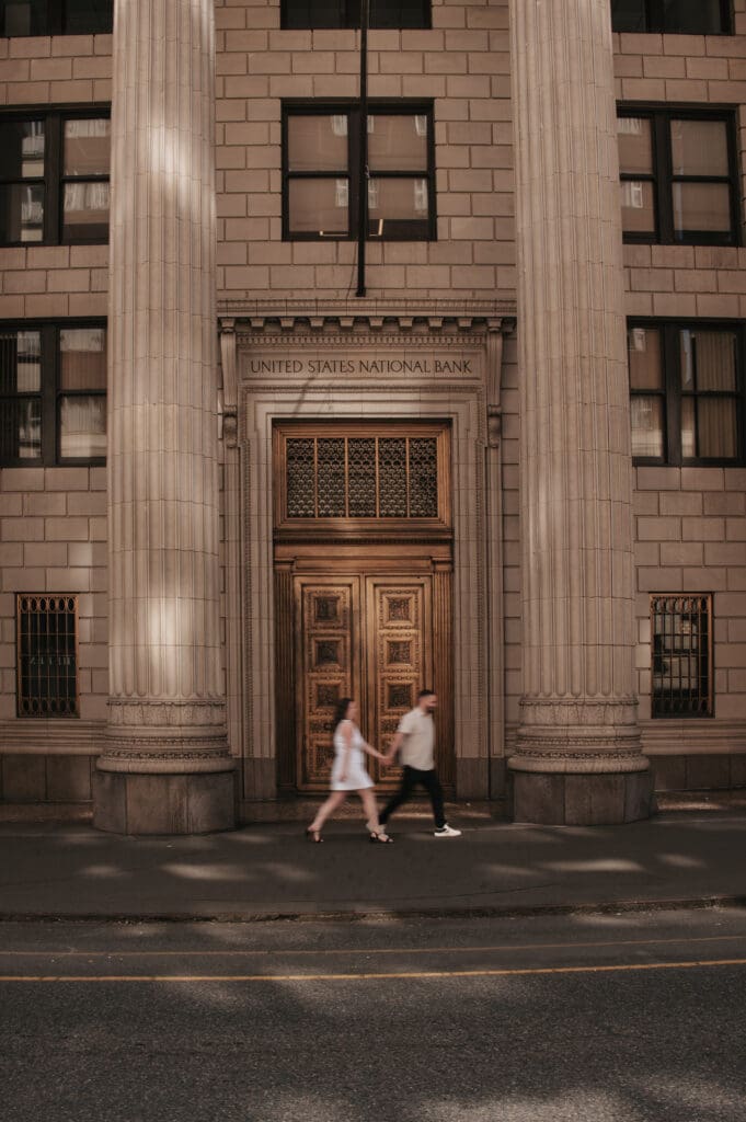 Engagement photo in front of a historic Downtown Portland building, featuring architectural details for Portland elopement photography.