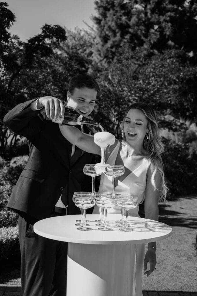Champagne tower pour at Chateau de Lis wedding reception