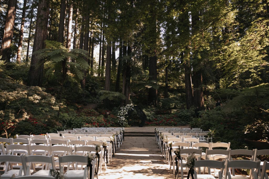 Ceremony site surrounded by redwoods at Nestldown wedding venue in Los Gatos, California.