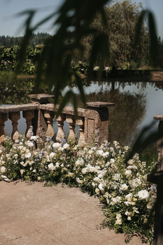 Floral ceremony details overlooking the grounds of Villa Catalana Cellars.