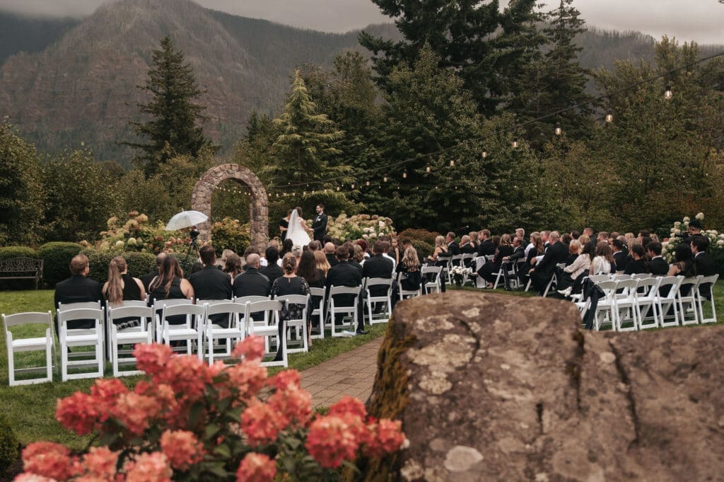Guests watching outdoor wedding ceremony at Cape Horn Estate in Washington