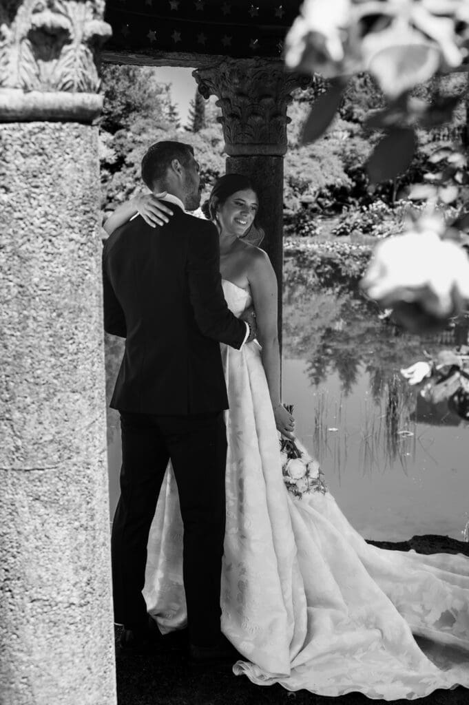 Intimate black and white wedding portrait captured beside the water at Villa Catalana Cellars.