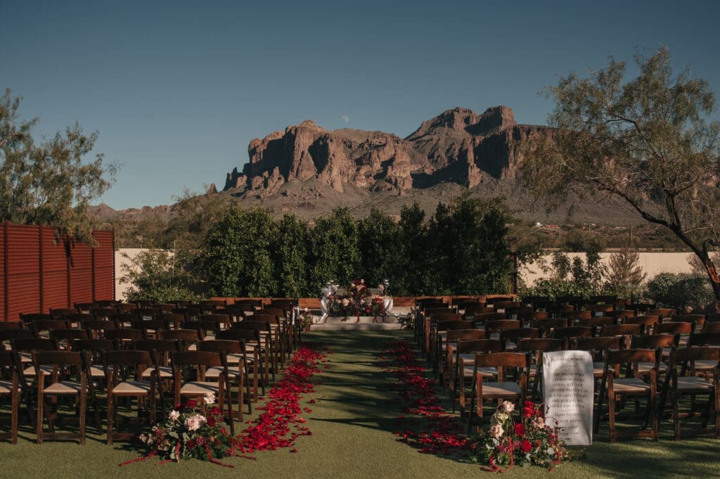 Luxury wedding ceremony setup at The Paseo wedding venue in Apache Junction Arizona with Superstition Mountain views.