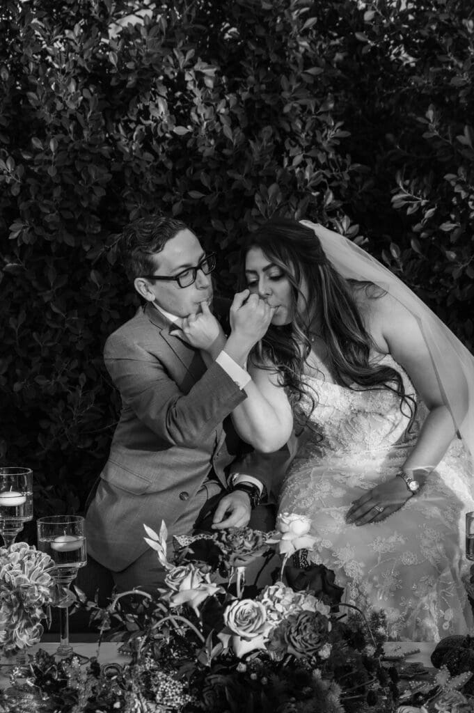 Bride and groom participate in Persian honey wedding tradition during ceremony