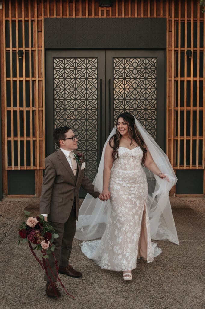 Luxury bride and groom portrait outside The Paseo Venue in Apache Junction, Arizona.