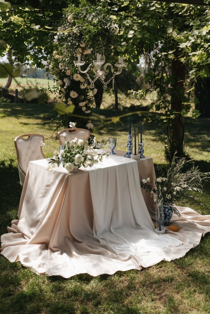 Refined outdoor sweetheart table styling and florals at Villa Catalana Cellars wedding venue captured by Scottsdale, AZ wedding photographer