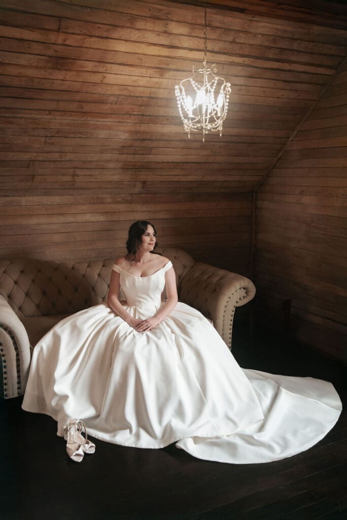 Bride sitting in elegant bridal suite during Cape Horn Estate wedding in Stevenson, Washington.