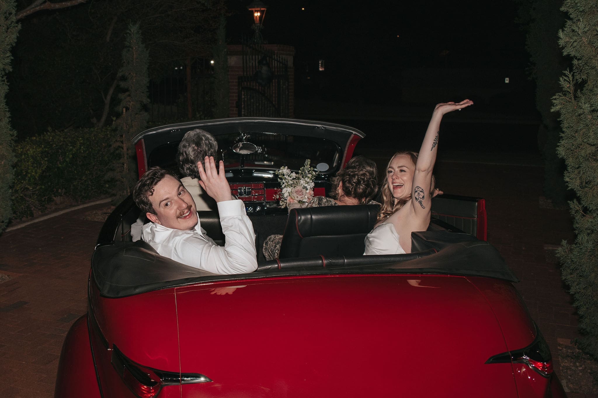 Bride and groom in exit car at their Stonebridge Manor wedding