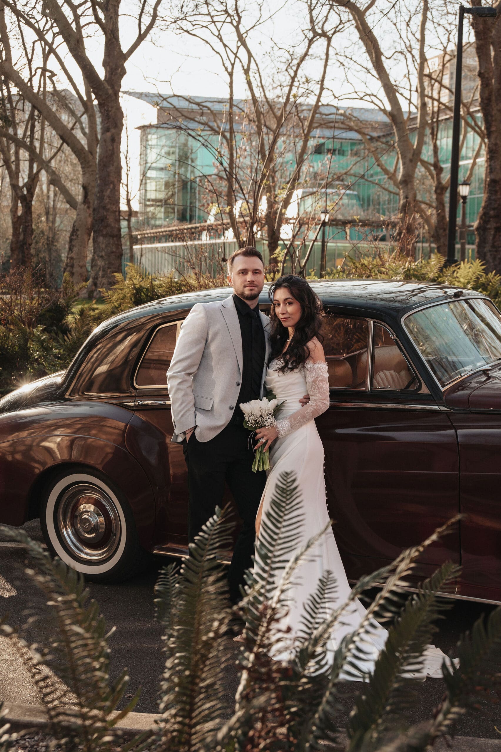 Couple with a vintage car at their Seattle Courthouse wedding
