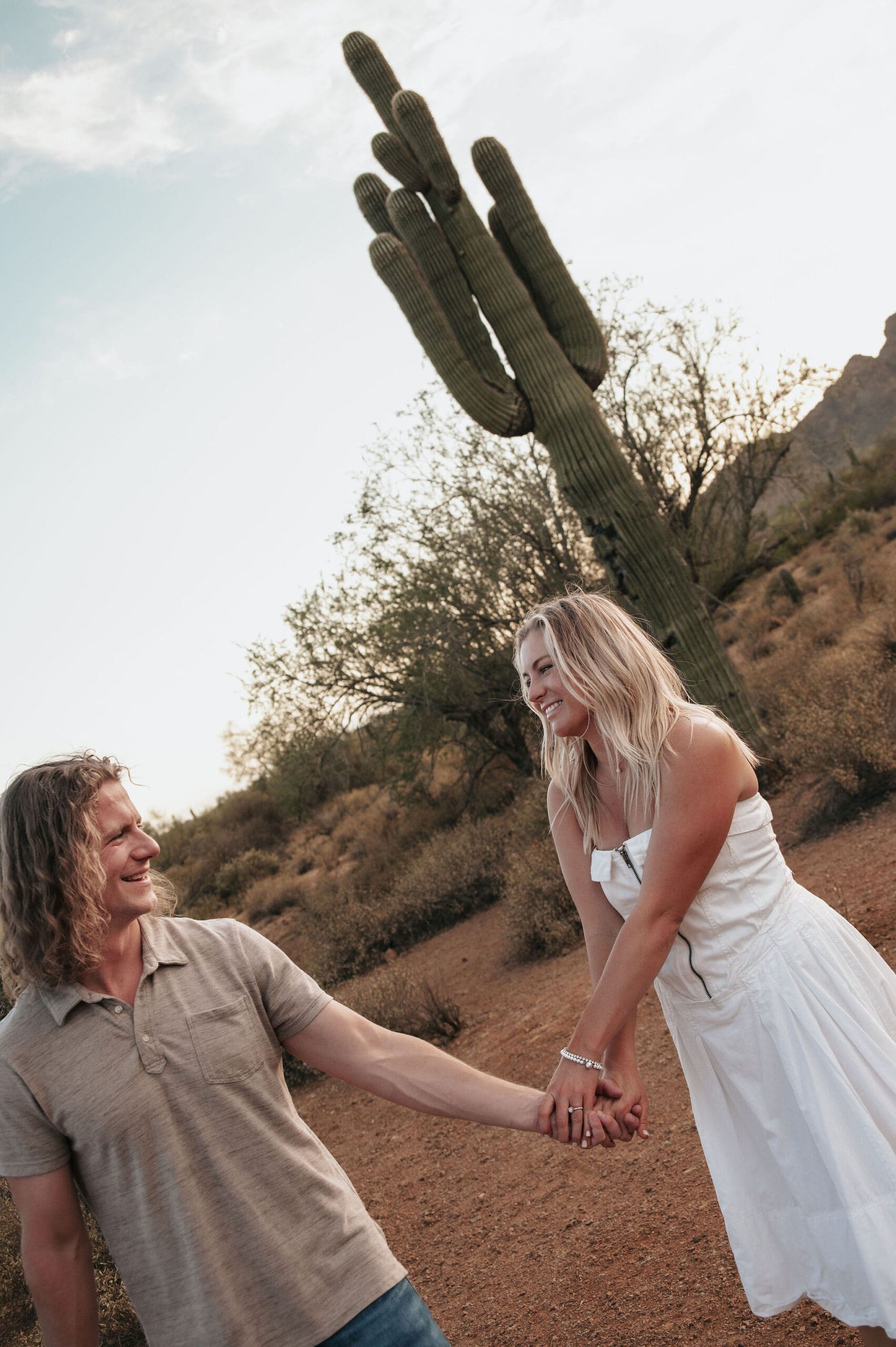 Couple holds hands during their Phon D Sutton engagement photos