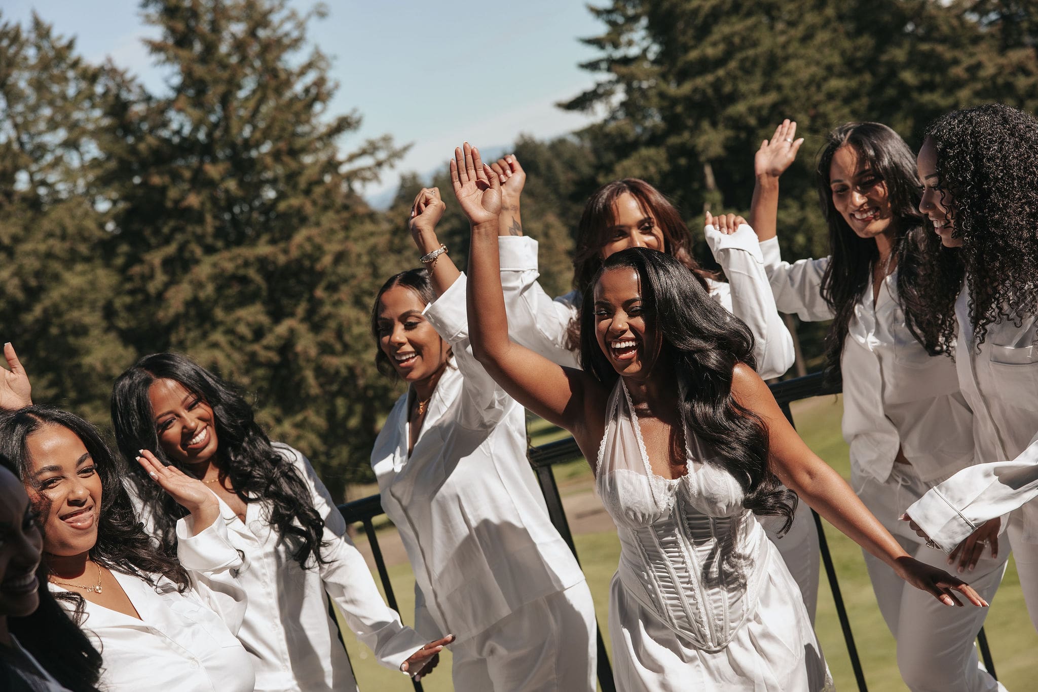 Bride and bridesmaids in pajamas at the Oregon Golf Club wedding